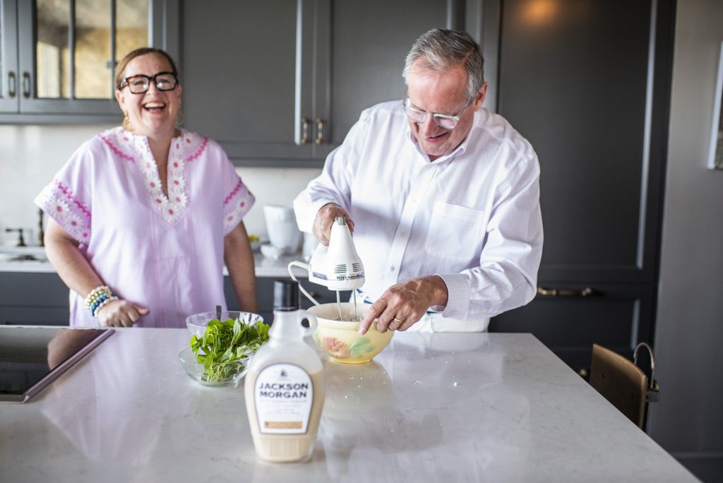Paige Minear and Steve McKenzie cooking with Jackson Morgan Cream