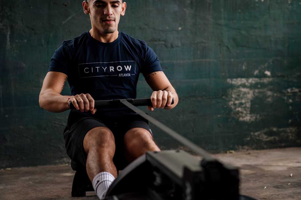 Man on rowing machine